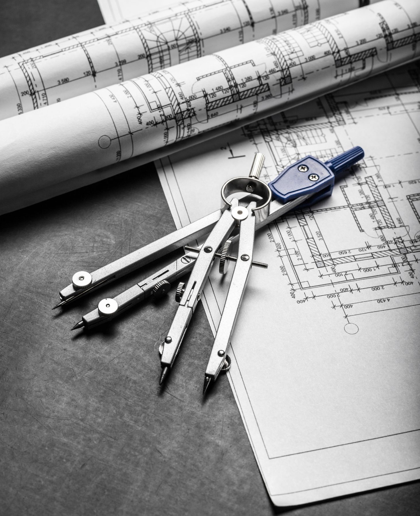 Construction planning drawings on black background