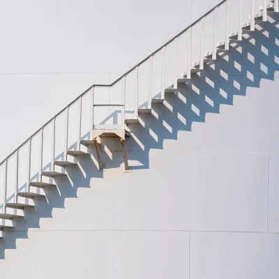 sunlight-and-shadow-on-surface-of-spiral-staircase-2025-03-11-15-47-10-utc-scaled