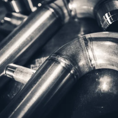 welded-stainless-steel-pipes-close-up-2025-03-28-09-49-43-utc-scaled